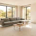Panoramic view of a bright minimalist living room with clean line furniture for small spaces.
