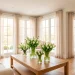 Bright living room with spring decor, pastel accents, and fresh tulips on a coffee table.