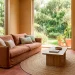 Wide horizontal living room with terracotta tiles, clay linen sofa, and earthy interior design elements.