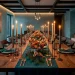 Wide landscape view of a modern 2026 Christmas table featuring teal linens and copper festive decor.
