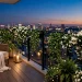 Lush evening balcony garden with fragrant white flowers and warm glowing lanterns at twilight for relaxation.