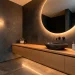 Luxury modern powder room with a floating oak vanity and a large circular backlit mirror for a spacious feel.