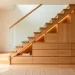 Modern Scandinavian home featuring integrated oak under-stair storage drawers and warm LED lighting.