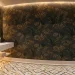 Luxurious small powder room with floating marble vanity, backlit mirror, and dark botanical wallpaper in a wide shot.