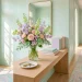 A wide, bright entryway with pastel decor, spring flowers on a console table, and soft morning light for Mother's Day.