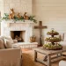 Cozy farmhouse living room featuring rustic wood Easter decorations, wooden bunnies, and spring greenery in a sunlit space.