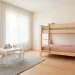 Wide shot of a minimalist Scandinavian kids room with a light wood bunk bed and airy decor.