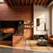 Industrial urban loft with red brick accent walls and modern furniture in a sunny interior.