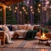 Wide panoramic view of a cozy hygge porch with warm lighting and comfortable furniture at dusk.