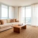 Wide shot of a warm and inviting studio apartment with cozy decor and soft natural lighting.