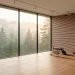 Wide panoramic view of a minimalist Scandinavian home gym with natural wood accents and large windows.