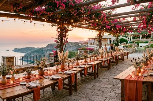 Wide shot of a sun-drenched Mediterranean wedding reception with terracotta decor and sunset lighting.