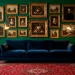 Sophisticated maximalist living room with emerald walls, navy velvet sofa, and gold accents in a rich jewel tone palette.