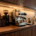 A luxurious and modern home coffee bar setup with professional brewing equipment and stylish decor.