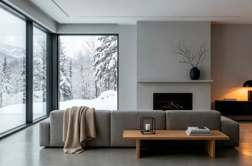 Modern minimalist living room styled for winter with matte black decor pieces and warm ambient lighting