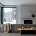 Modern minimalist living room styled for winter with matte black decor pieces and warm ambient lighting