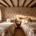 Cozy English cottage guest room featuring two twin beds with layered floral patterns and vintage wallpaper