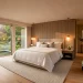Luxury boutique guest room with high-end bedding and elegant designer lighting in a neutral palette.