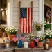 Cozy modern farmhouse porch decorated with rustic upcycled Memorial Day crafts and a tea-stained flag