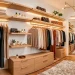 Beautifully organized small dressing room featuring creative hanging hacks and warm lighting