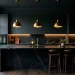 Luxurious moody dark kitchen featuring matte charcoal cabinets, brass pendant lights, and warm glowing under-cabinet LED strips.