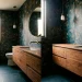 Small powder room featuring a floating walnut vanity and dramatic dark floral wallpaper