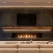 A luxury living room showing a TV safely mounted above a fireplace with a thick protective mantel.