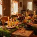Enchanting woodland themed fall dining table decor with moss runner, glowing candles, and amber goblets.