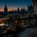 Moody Dark Academia balcony at twilight with vintage wrought iron furniture and amber lanterns