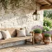 Elegant French Country spring porch decor with a weathered wood bench and blooming lavender pots under morning light.