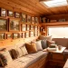 Wide panoramic shot of a cozy camper van interior featuring a beautifully curated tiny gallery wall on wood paneling.