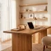 A modern warm minimalist home office featuring a light oak desk, a linen ergonomic chair, and pure linen curtains filtering soft natural light.
