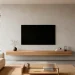 Modern minimalist living room featuring a sleek wooden fireplace mantel perfectly balancing a flat screen TV above.