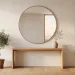 Wide landscape view of a serene Japandi style entryway with minimalist wooden furniture and soft lighting.