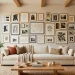 A cohesive gallery wall above a cream sofa in a warmly lit, modern living room demonstrating aesthetic photo editing.