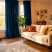 Cozy small living room featuring elegant, opulent velvet drapes pooling on the floor in warm sunlight
