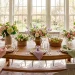 Beautifully styled spring dining table featuring creatively folded pastel linen napkins