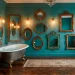 Wide view of a luxury vintage bathroom featuring multiple ornate antique mirrors on a teal wall.