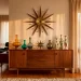 Wide landscape of a mid-century modern interior featuring authentic vintage ornaments and starburst decor.
