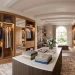 Luxurious modern walk-in dressing room closet with wood cabinetry and central island