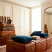 Wide shot of a luxury dressing room featuring repurposed vintage trunks used as furniture and storage.