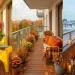 Wide panorama of a decorated apartment balcony showing seasonal transitions from summer to winter.
