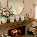 Beautifully styled modern fireplace mantel featuring Mother's Day greeting cards, spring flowers, and brass candle holders.