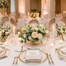 Elegant wedding table setting featuring a custom calligraphy place card resting on a napkin