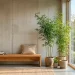 Minimalist zen corner in a modern living room featuring slender bamboo in a stone planter