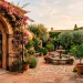 Lush Mediterranean courtyard featuring a prominent arched wrought iron gate and terracotta stucco walls.