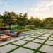 Luxurious modern geometric concrete patio featuring inlaid living grass perfectly separating large concrete pavers.