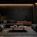 Moody Scandi-Noir living room featuring a dark charcoal sofa, matte black walls, and walnut accents.