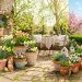 Colorful hand-painted terracotta pots decorated for Easter on a sunny spring patio.