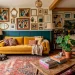 Vibrant eclectic living room with a mustard velvet sofa, vintage Persian rug, and maximalist gallery wall.